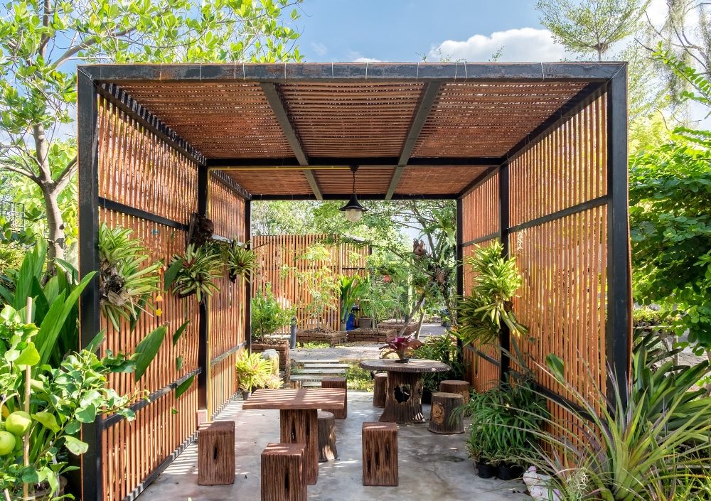 Timber pergola with vertical battens over an outdoor dining area